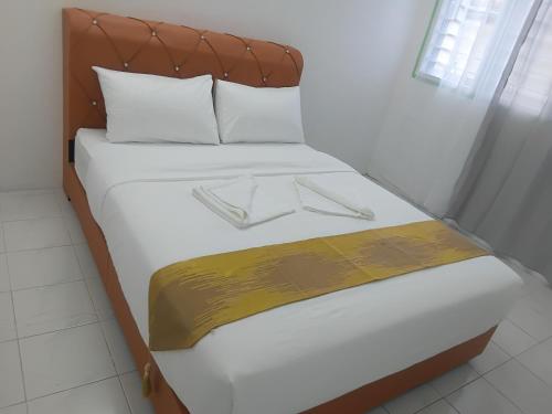 Una cama o camas en una habitación de Olive home