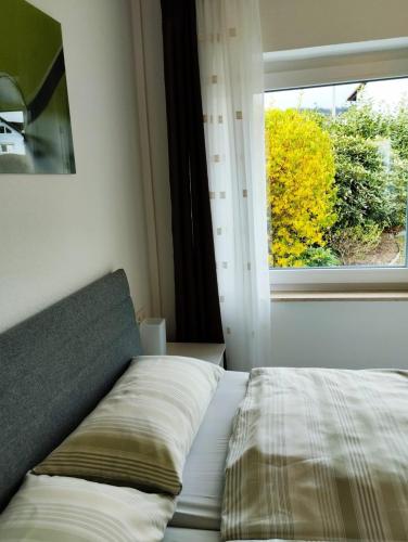 Ένα ή περισσότερα κρεβάτια σε δωμάτιο στο Ferienhaus Ferienwohnung Schöneberg