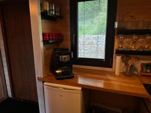 a kitchen with a counter with a coffee maker on it at Hájská chata in Teplice