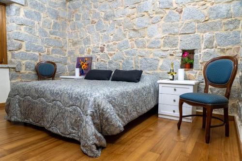 Ένα ή περισσότερα κρεβάτια σε δωμάτιο στο Villa S'Olioni