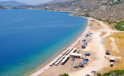 an aerial view of a beach with a bunch of cars at Vivari apartment in Vivari