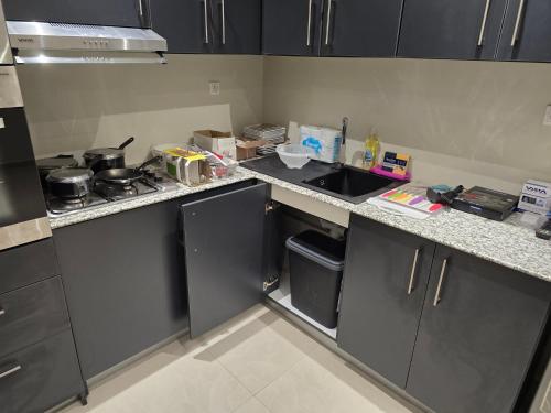a kitchen with a sink and a counter top at Santosh in Toamasina
