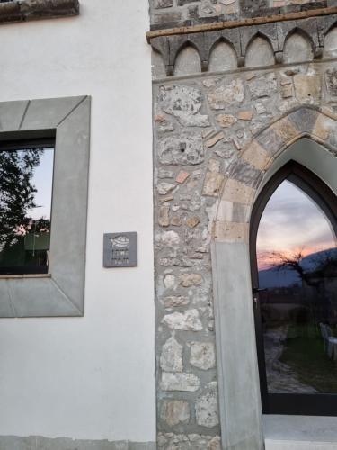 an archway on a building with a window at LIMO to Host in Roccaromana