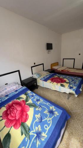 Hotel Quatre Saisonにあるベッド