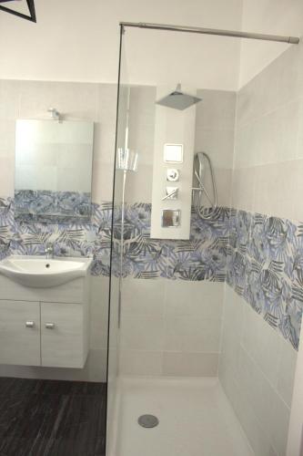 a bathroom with a shower and a sink at D&C House in Galatone