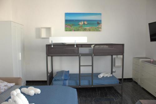 a bunk bed in a room with a bed at D&C House in Galatone