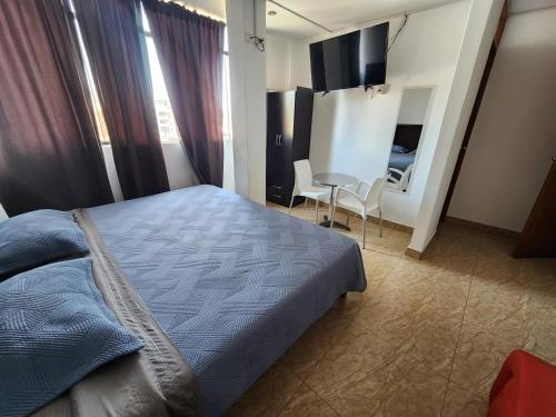 Postel nebo postele na pokoji v ubytování Hospedaje Wankko