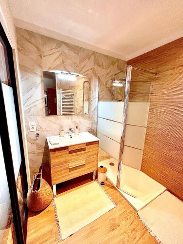 a bathroom with a sink and a shower at Le Mas Justin in Gordes
