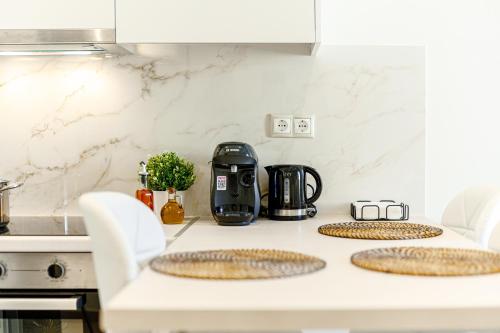 Η κουζίνα ή μικρή κουζίνα στο Aster Apartments