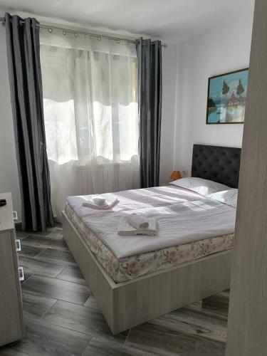 Un pat sau paturi într-o cameră la Residence EOS