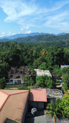 a view of a city with houses and trees at Johans Villa Kandy in Kandy
