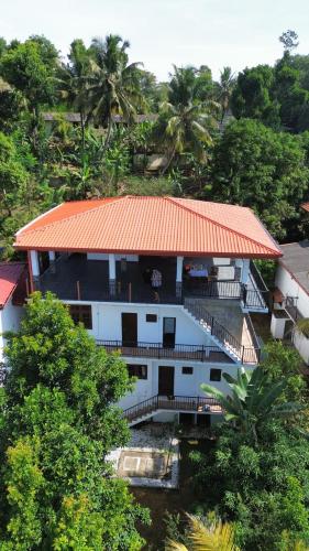 an aerial view of a building with an orange roof at Johans Villa Kandy in Kandy