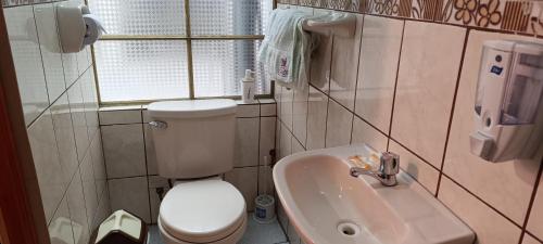 Koupelna v ubytování Hostal Sumak'usi