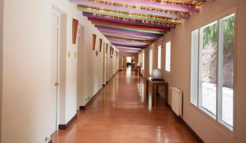 a hallway with a rainbow ceiling in a building at Hotel Huacalera in Huacalera