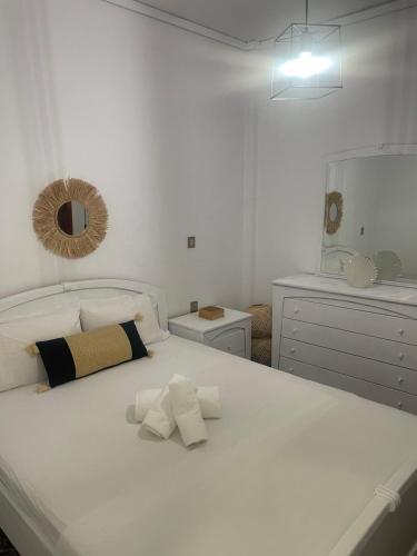 a bedroom with a white bed with two pillows on it at Sugar V 28 in Vergia