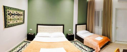Postel nebo postele na pokoji v ubytování VILA LILI Guest House - Berat