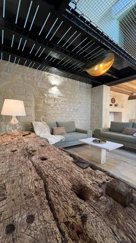 Katil atau katil-katil dalam bilik di Gîte du Puits Chauveau Spa Vignes Chateaux 8pers