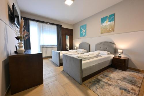 Ένα ή περισσότερα κρεβάτια σε δωμάτιο στο Hotel Lane