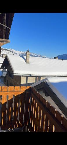 a view from a balcony of a house with a roof at Charmant appartement Lens - Crans-Montana in Lens