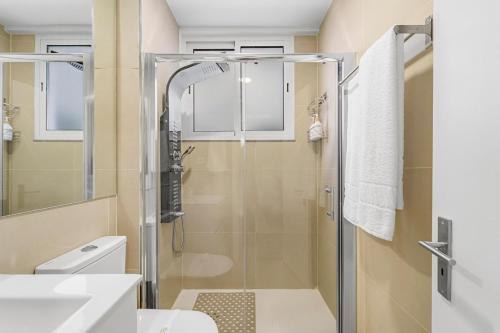 a bathroom with a shower and a toilet and a sink at Green Living-Funchal in Funchal