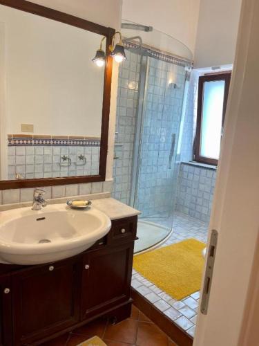 a bathroom with a sink and a shower at Relais Fontania in Gaeta