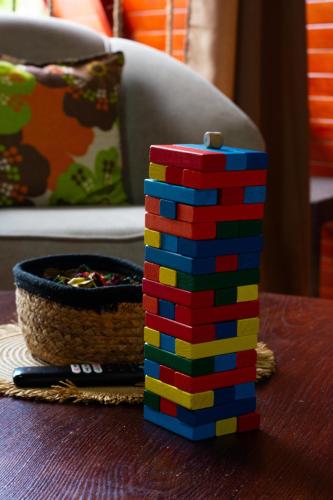 a stack of legos sitting on a table next to a bowl at Betulio's Oasis in Fortuna
