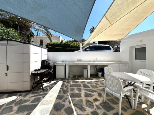 a patio with a table and chairs and a table and a table and chairs at STAY ALKYONI Villa in Protaras