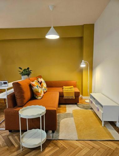 a living room with a couch and a table at Lovely Sparkly Apartment in Krakow