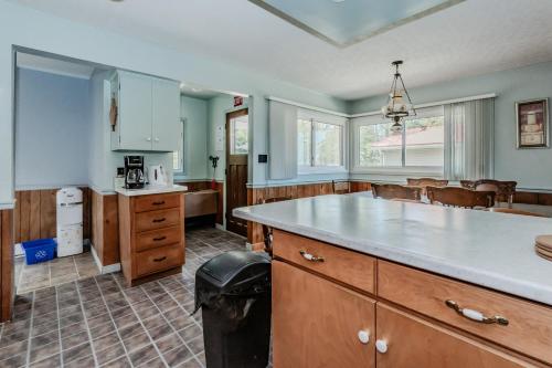 a large kitchen with a counter and a sink at Beeshore Lakehouse Waterfront Bliss & Comfort in Lions Head