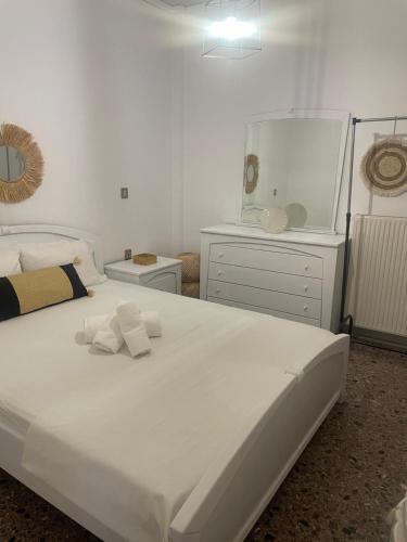 a bedroom with a large white bed and a large mirror at Sugar V 28 in Vergia