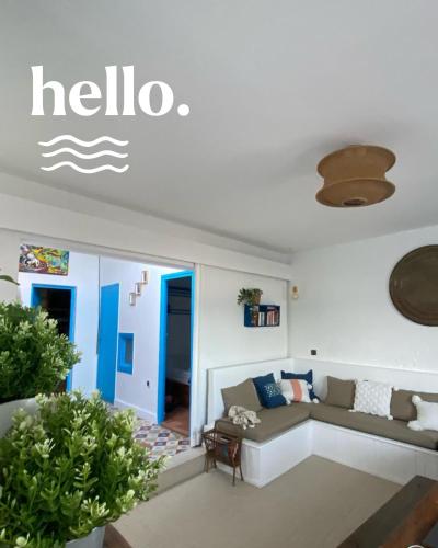 a living room with a couch and a table at Afoulki Home in Taghazout