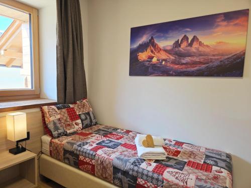Letto o letti in una camera di Alpine Lodge Tesero - Alpine Stay Apartments