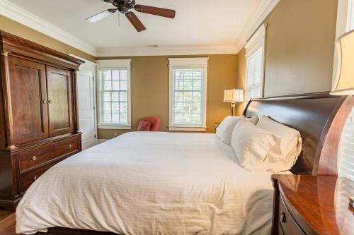 a bedroom with a bed and a ceiling fan at 1 Mile to Omni Homestead w/ 5 suites + Gameroom in Hot Springs