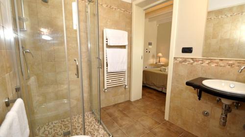 a bathroom with a shower and a sink at Don Alfonso Dimora D'epoca in Racale