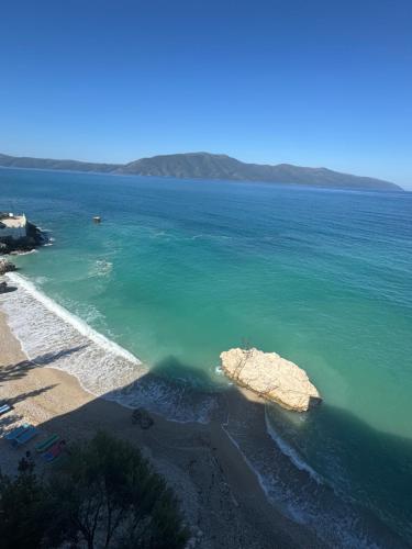 an aerial view of a beach with a rock in the water at Hotel Sanremo Vlore in Vlorë