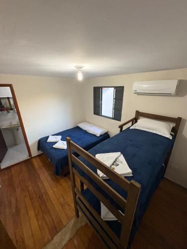 Ένα ή περισσότερα κρεβάτια σε δωμάτιο στο Hostel Paraiiso