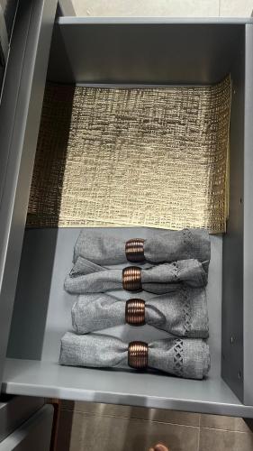 a bunch of towels are stacked in a drawer at Rota do Engawno in Barracão
