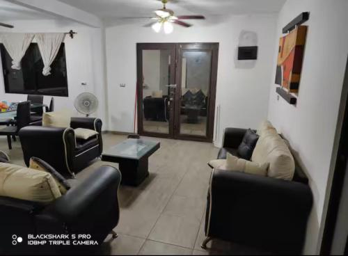a living room with couches and a table at Casa Monte Cristo in Chachalacas