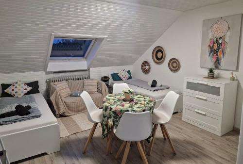 a small living room with a table and chairs at Cosy Apartment in City 1 in Kassel