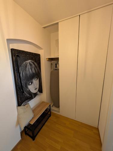 a room with a black and white picture on the wall at Helles Studio mit Arbeitsplatz und Balkon in Chemnitz