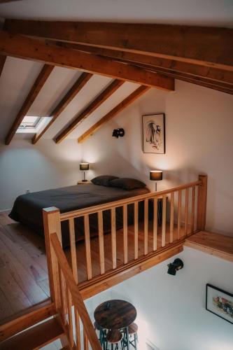 a bedroom with a bed in a room with wooden ceilings at Casa da Mina - Pendilhe in Pendilhe