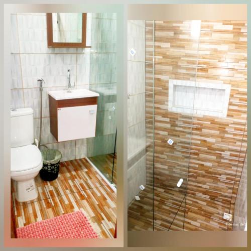 a bathroom with a toilet and a glass shower at Casa da Ana in Ananindeua