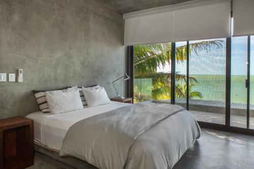 Postel nebo postele na pokoji v ubytování Casa Gonza Holbox