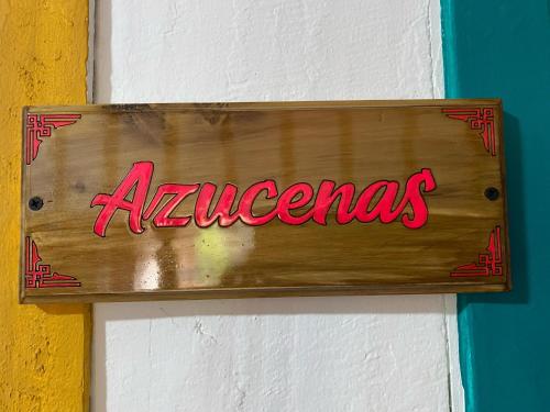 a sign on a wall with the word amazzos at Hostal Casa Celeste in Murillo