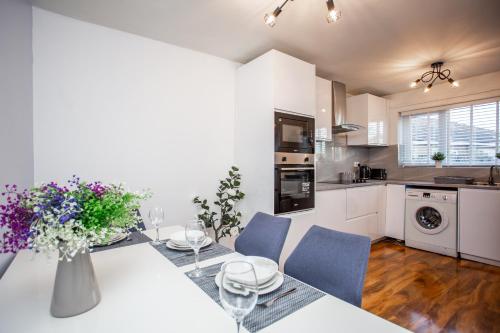 a kitchen and dining room with a table and chairs at Prime House - St James Park - Newcastle in Newcastle upon Tyne