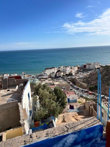 a view of a city and the ocean at Skb Sea House Taghazout in Taghazout