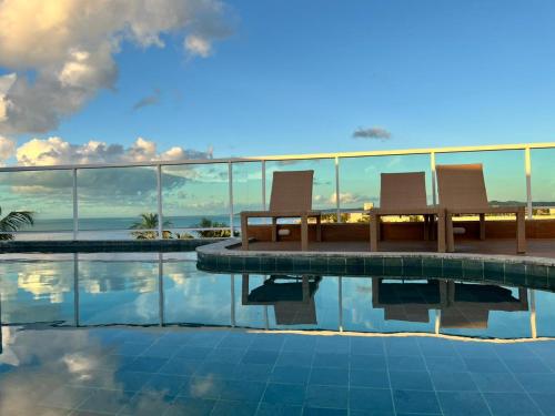 Swimmingpoolen hos eller tæt på Condomínio Jardim dos Coqueiros