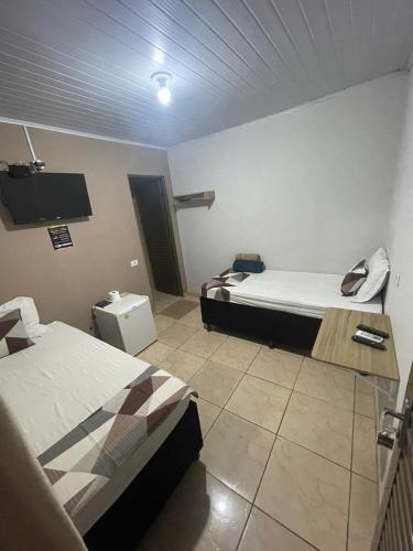 Ένα ή περισσότερα κρεβάτια σε δωμάτιο στο Hotel Stillus