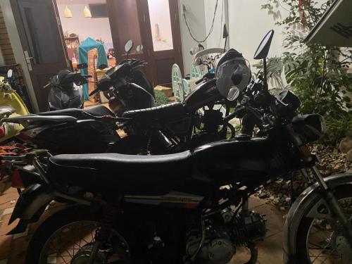 a group of motorcycles parked in a room at Berry homestay 1 in Buon Ma Thuot