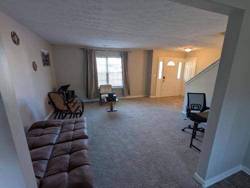 a living room with a couch and a television in it at Charming 3 Bedroom Home in Conley
